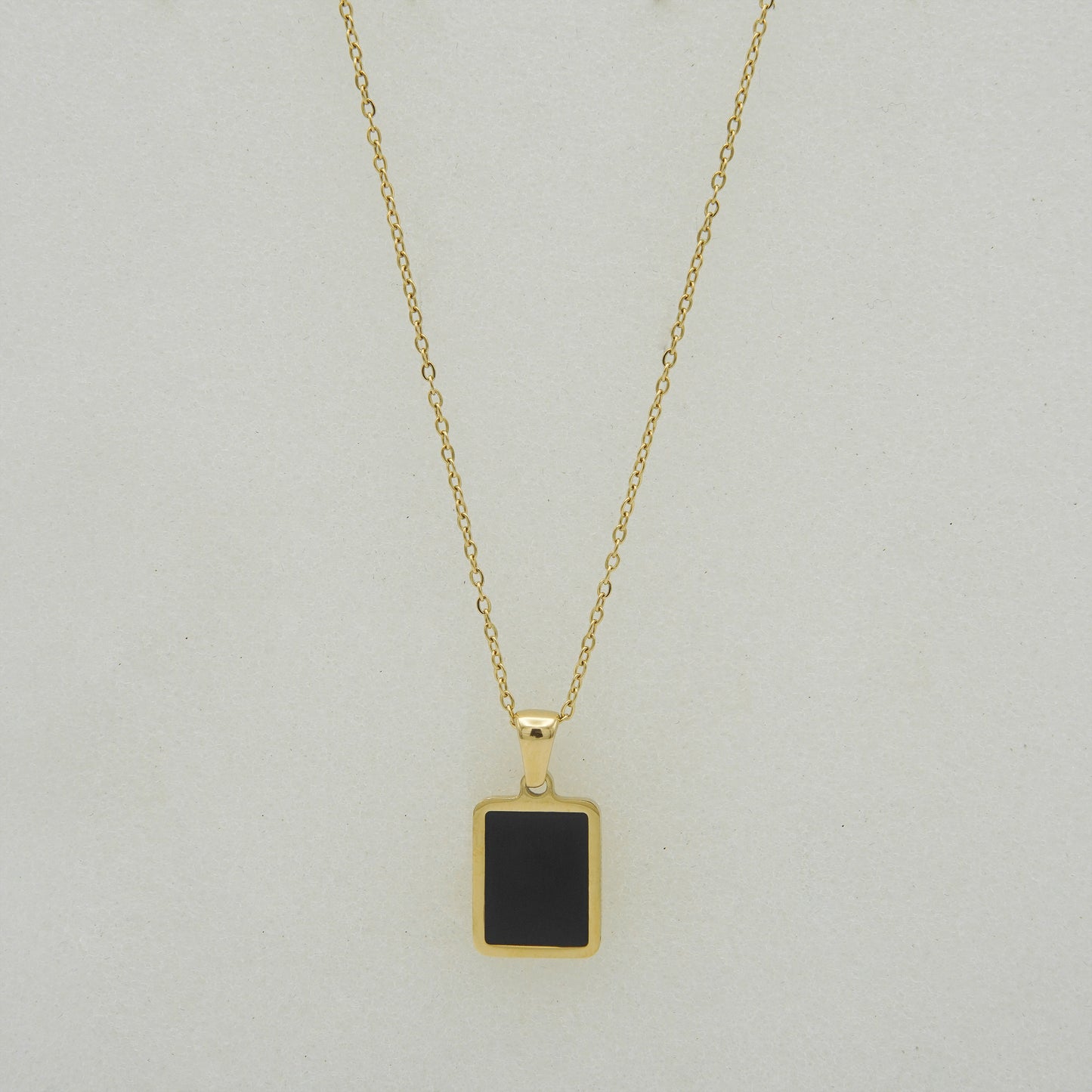 Elegant Gold Pendant Necklace with Black Onyx